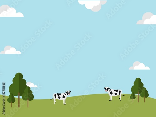 Illustration of two cows, which are farm animals, in a green meadow under a blue sky with floating clouds, amidst the peaceful nature.
