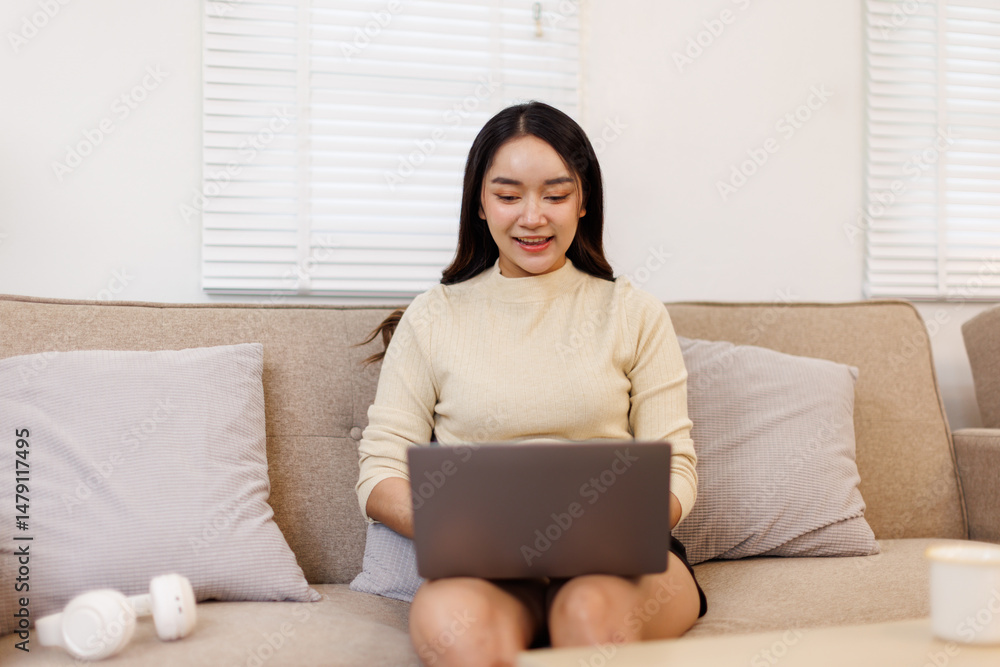 Beautiful Young Asian woman using laptop computer on sofa at home, shopping online with internet in happy mood and Relax part time concept
Beautiful Young Asian woman using laptop computer on sofa at home, shopping online with internet in happy mood and Relax part time concept