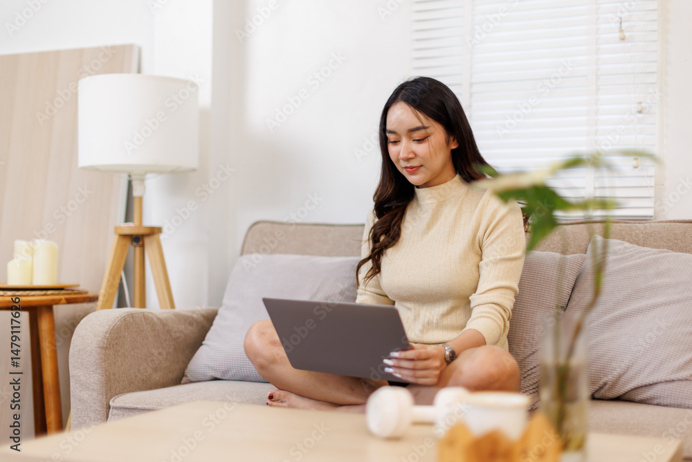 Beautiful Young Asian woman using laptop computer on sofa at home, shopping online with internet in happy mood and Relax part time concept
Beautiful Young Asian woman using laptop computer on sofa at home, shopping online with internet in happy mood and Relax part time concept