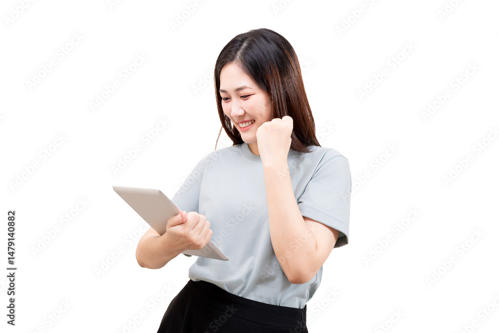 Asian young woman smiling and celebrating while looking at a digital tablet. Asian young woman smiling and celebrating while looking at a digital tablet.
