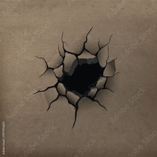 Dark hole and diverging cracks on brown concrete wall.