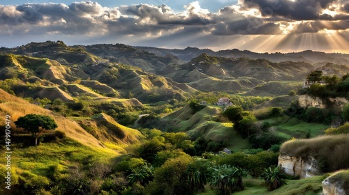 overlooking vast green valleys with sunbeams piercing through clouds