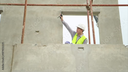 Engineers construction projects inspect and supervise the construction of building walls and foundations of residential buildings