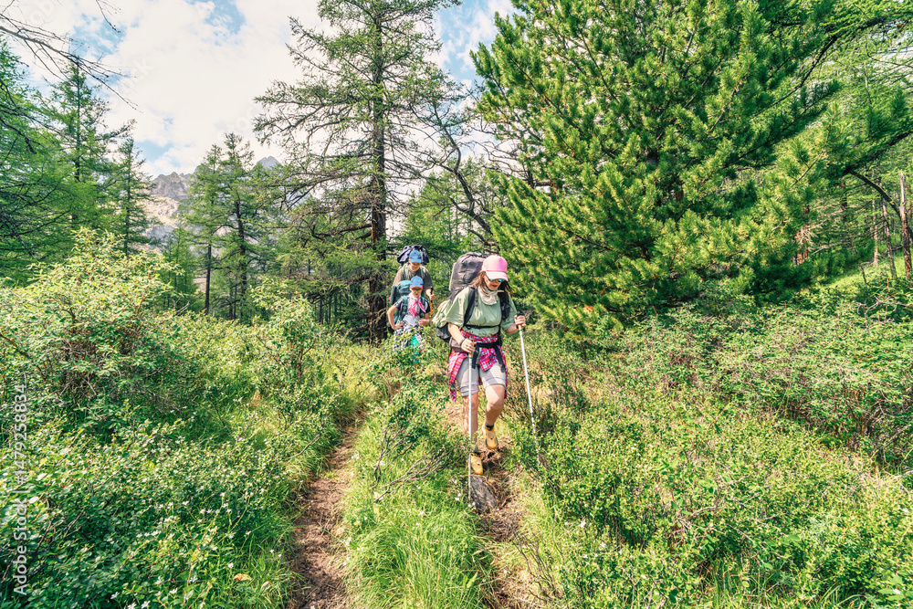 Naklejka premium Family trip in the mountain forest 