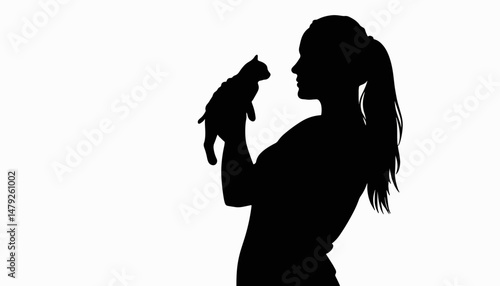 Silhouette of woman cradling a cat, love for animals