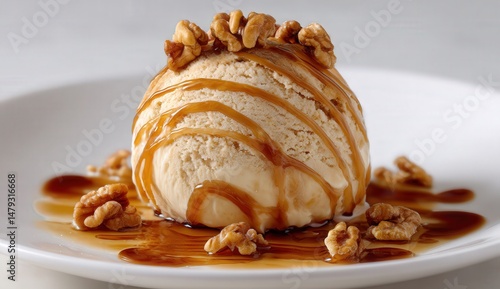 Vanilla ice cream drizzled with caramel and walnuts.