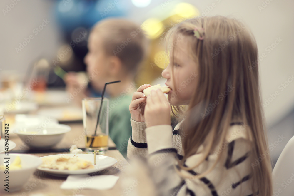 Children's party children at the table, children's birthday dinner Children's party children at the table, children's birthday dinner