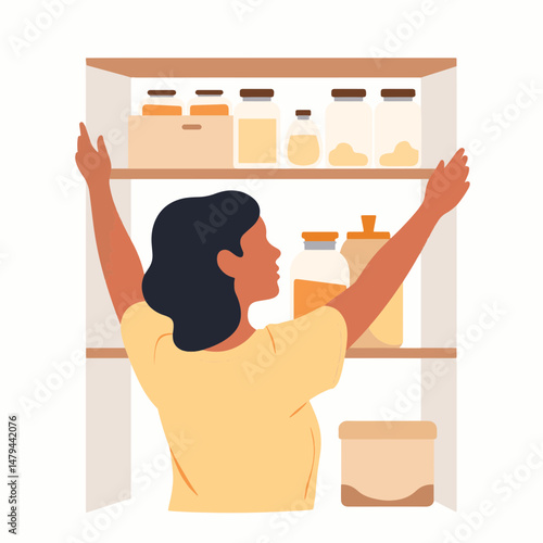 Woman organizing pantry shelves with geometric containers, minimalism
