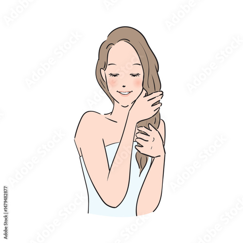 丁寧にヘアケアをするロングヘアの女性