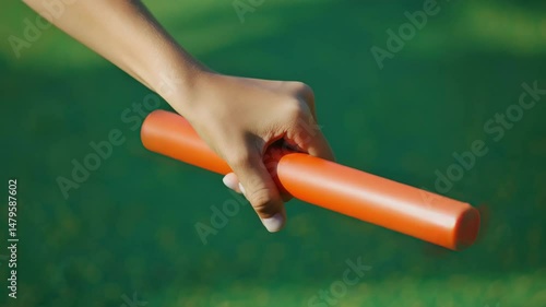 A athletics relay baton in one hand, Generative AI Videos.