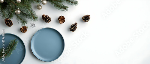 Christmas Table Setting With Blue Plates and Pine Cones
