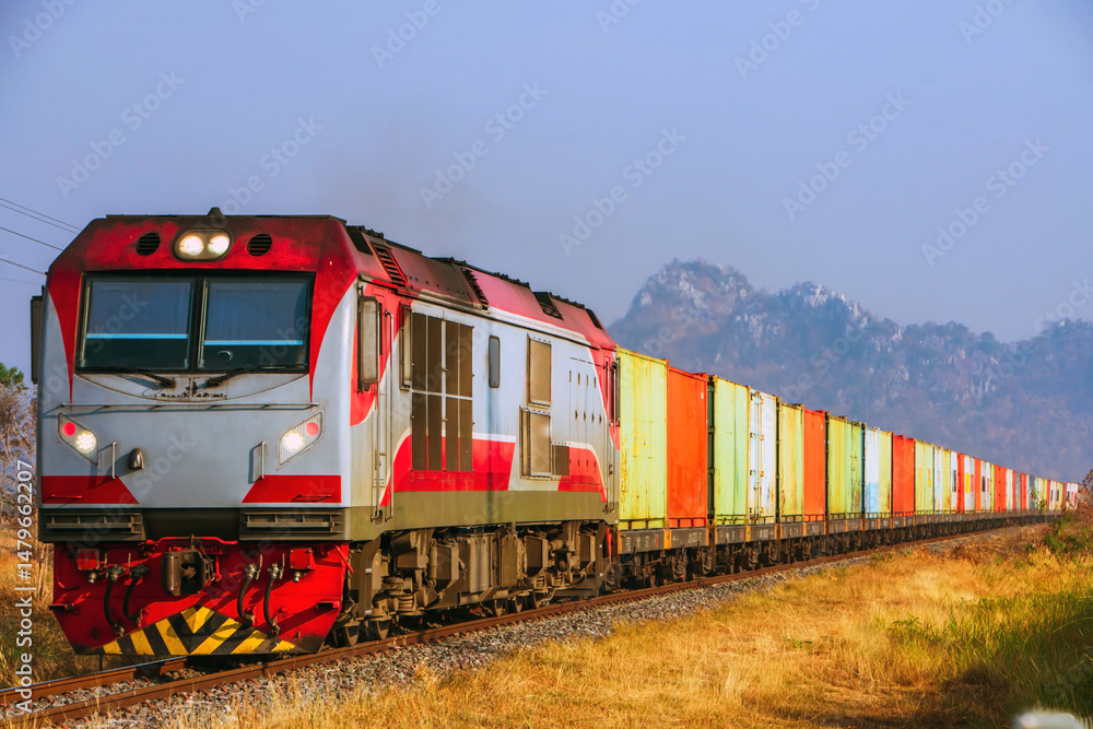 Naklejka premium Locomotive with cargo containers on the railway, Thailand.