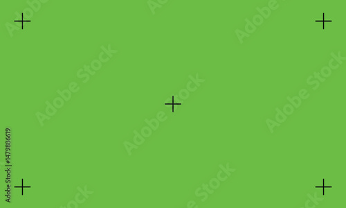 Green screen background with alignment crosses for video and image compositing. Ideal for visual effects, motion graphics, or chroma key editing in media production.