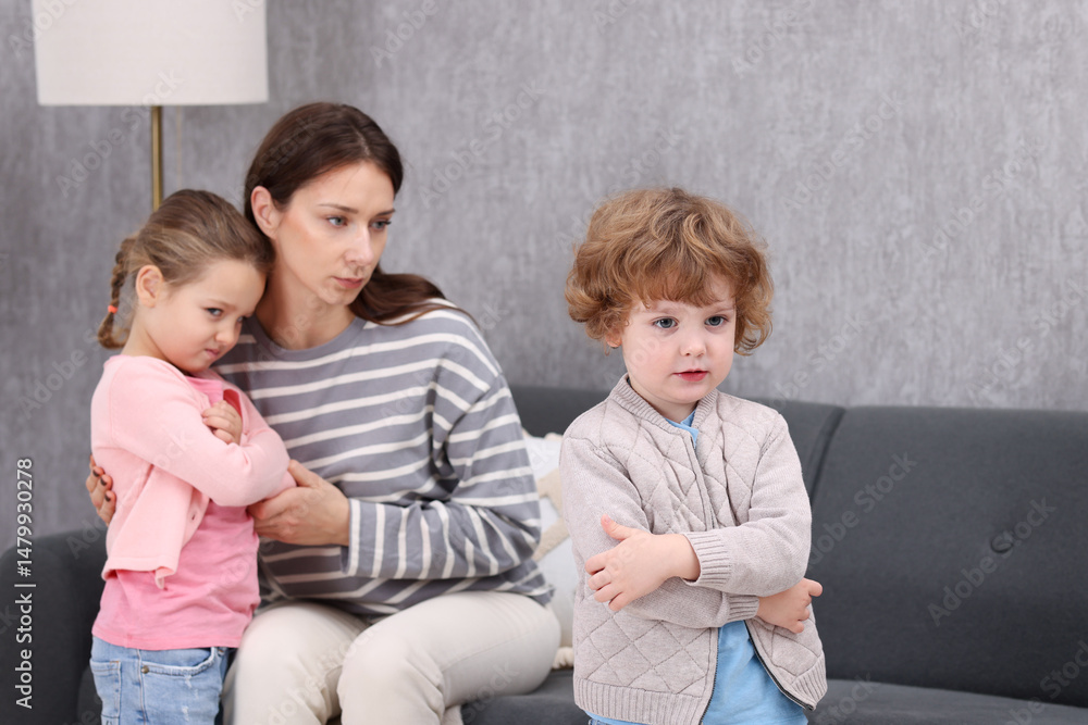 Resentful little kids and their mother arguing at home Resentful little kids and their mother arguing at home