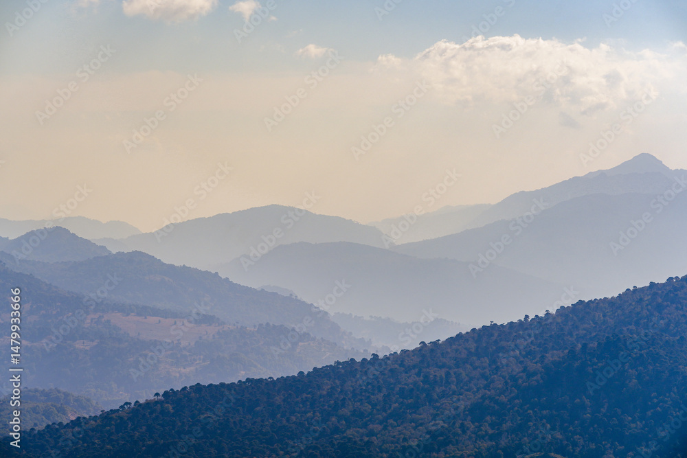 Scenic view at dusk shows a range of mountains Scenic view at dusk shows a range of mountains