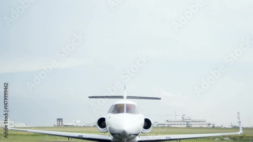 Private jet showcasing twin engines and landing gear, sitting on runway apron in 3D render