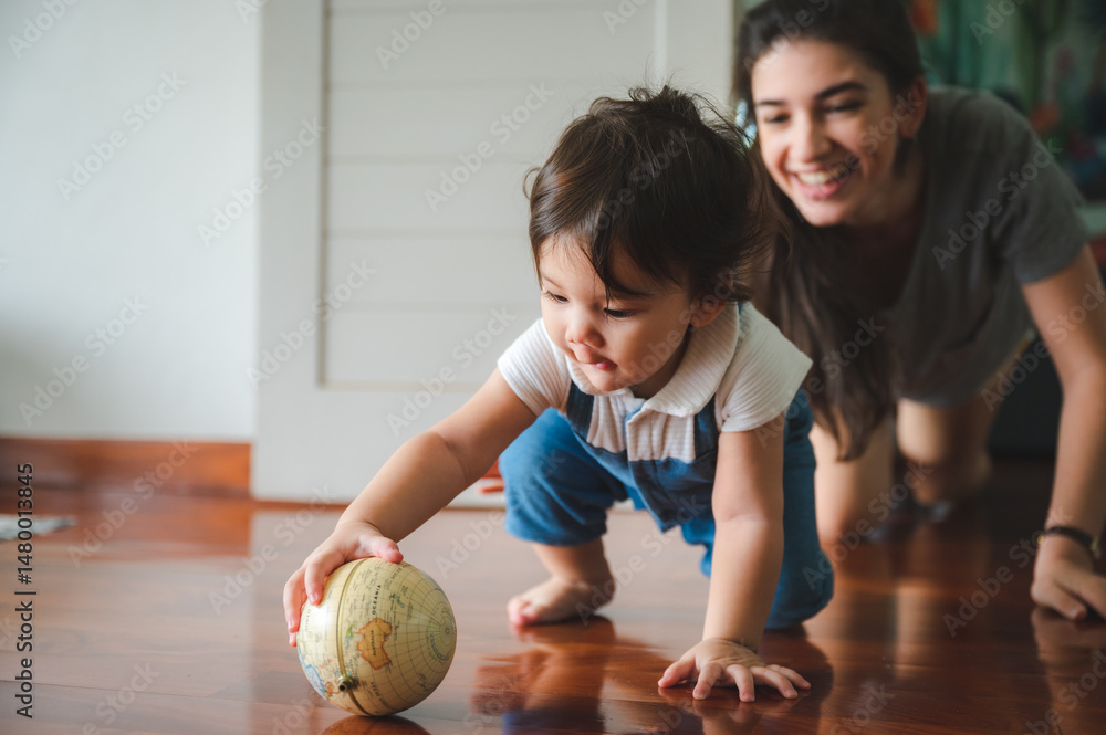 Fototapeta premium Happy Family at Home, Mother and Father Playing with Little Son, Fun Childhood Activities with Toys, Promoting Love, Education, and Parenthood in Joyful Indoor Setting