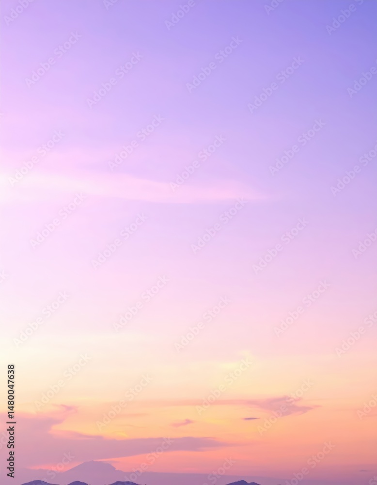 Obraz premium A breathtaking sunset casts vibrant hues of orange and pink across the ocean, reflecting on the water's surface, with majestic mountains silhouetted in the background.