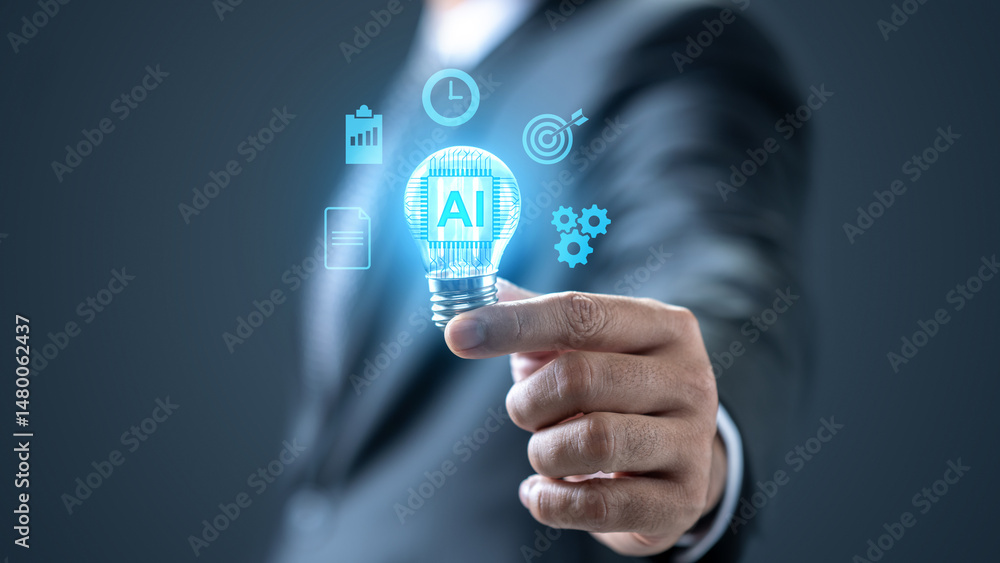 Businessman showing a light bulb with an AI symbol. Technology innovation on the virtual screen. Concept of AI or Artificial Intelligence Businessman showing a light bulb with an AI symbol. Technology innovation on the virtual screen. Concept of AI or Artificial Intelligence
