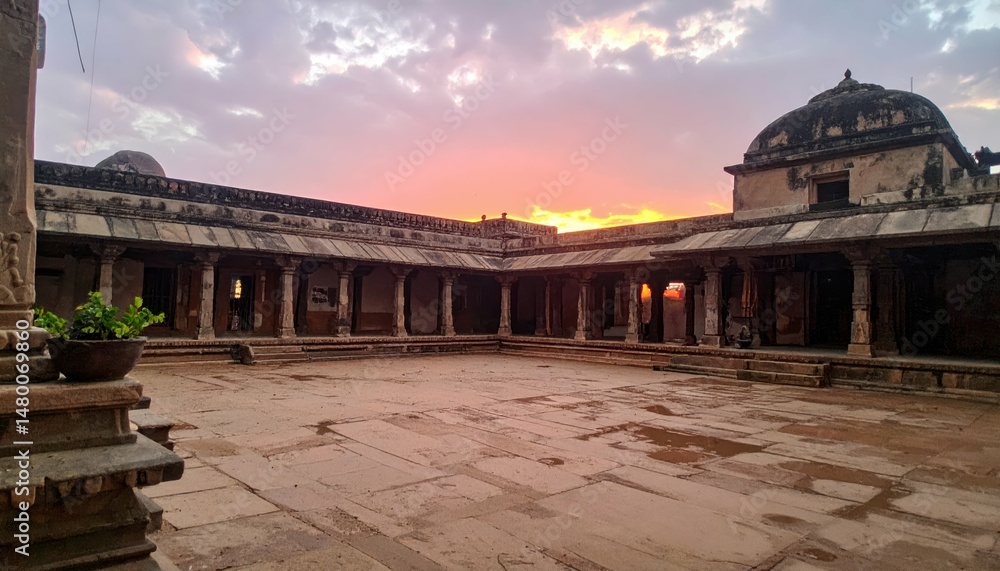 Fototapeta premium Serene Sunset Over Ancient Temple Courtyard with Stunning Architecture