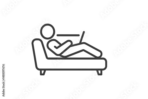 Person relaxing on a couch while using a laptop at home during a leisurely afternoon