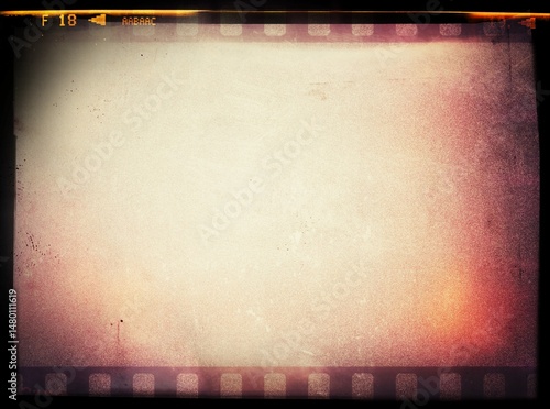 Old negative photo film with grain scratches dust, film grain  photo overlay background, light leaks texture effect. Grainy negative photo film textures