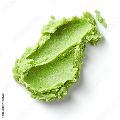 Creamy wasabi paste spread on white background