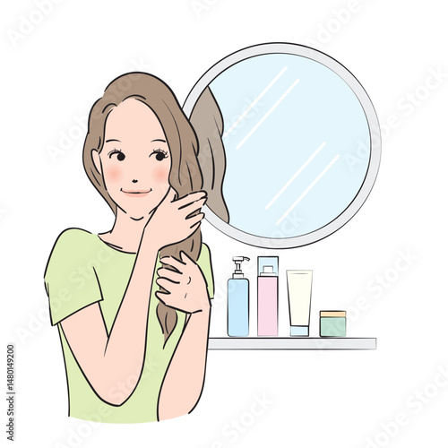 丁寧にヘアケアをするロングヘアの女性