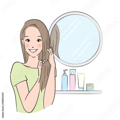 丁寧にヘアケアをするロングヘアの女性