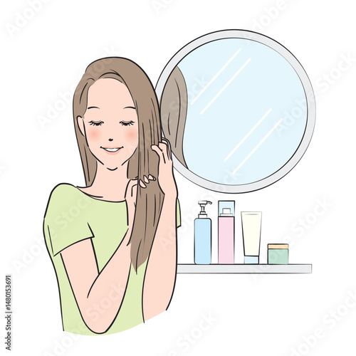 丁寧にヘアケアをするロングヘアの女性