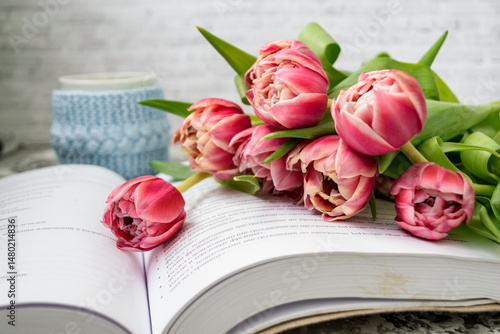 Pink tulips, an open book and a mug of freshly brewed coffee or tea. Spring set. Flatley layout.