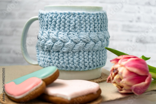 Pink tulips, an open book and a mug of freshly brewed coffee or tea. Spring set. Flatley layout.