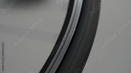 The wheel spins smoothly, forming a whirl of spokes that blur with speed