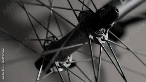 Continuous circular motion of a bicycle wheel, captured with a static camera. Great for backgrounds, presentations, or transition effects