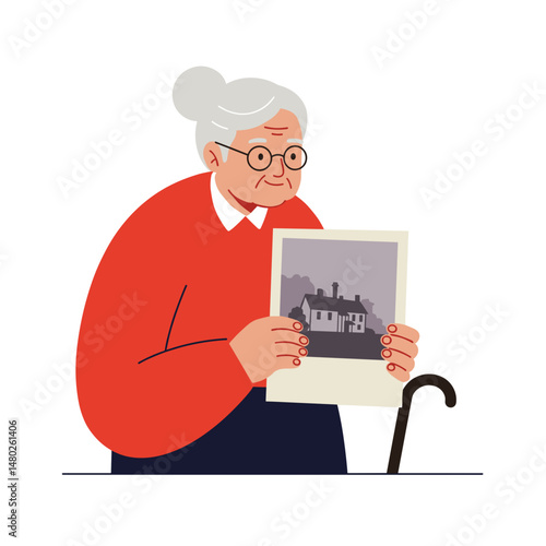 Elderly woman holding a vintage photo of a house with cane  
