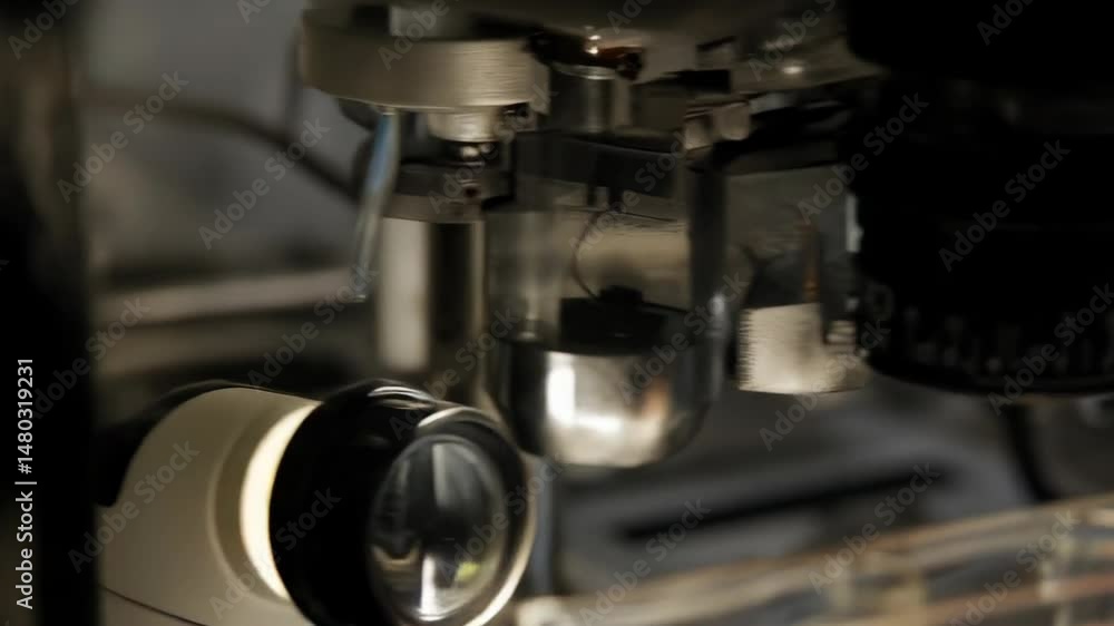 Close up of liquid being extracted from a test tube using pipette in lab with gloved hand. Close up of liquid being extracted from a test tube using pipette in lab with gloved hand.
