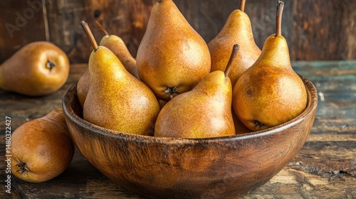 A rustic wooden bowl filled with golden-brown Bosc pears