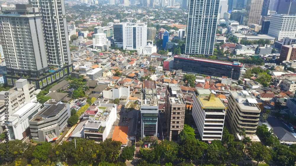 Obraz premium Aerial Cityscape with High-Rises and Urban Housing