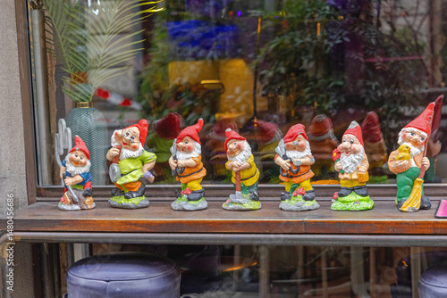 Fototapeta Old Ceramic Figurines of Seven Dwarfs Without Snow White at Wood Shelf Fairy Tal