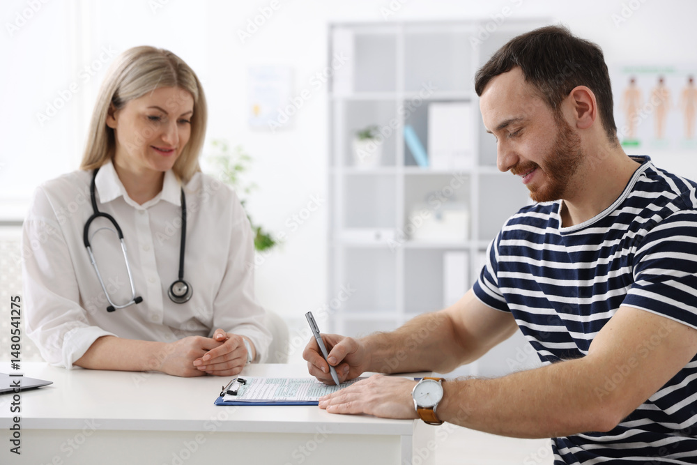 Fototapeta premium Man having appointment with doctor in hospital