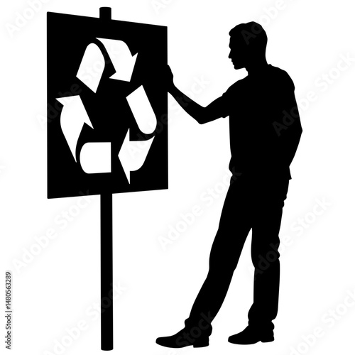 Silhouette of person hanging recycling sign on wall, eco advocacy and sustainability awareness