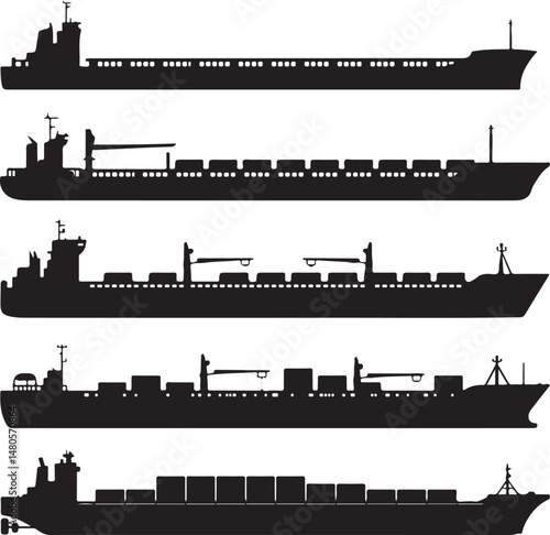 Silhouette of Shipping Vessels: This captivating image showcases an assortment of cargo ships. The stark silhouettes emphasize the sleekness of each vessel
