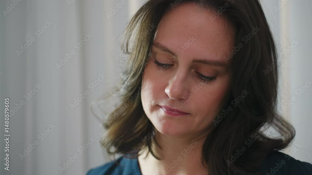 Skin care therapist concentrates with calm focused expression while performing facial treatment, illuminated by ring light, conveying professionalism and serene clinical ambiance during spa service Skin care therapist concentrates with calm focused expression while performing facial treatment, illuminated by ring light, conveying professionalism and serene clinical ambiance during spa service