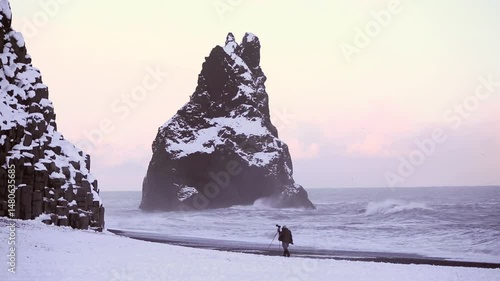 Wallpaper Mural Photographer at the black sand beach in Vik, Iceland, evening light Torontodigital.ca