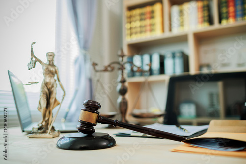 Obraz na płótnie Lady Justice, scales, and a gavel placed on a judge’s desk represent fairness and integrity in law and courtroom proceedings. w salonie