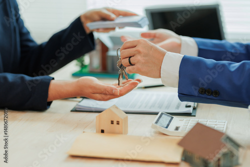 Client pays the agent, who hands over the house keys, marking the official closing and completion of the real estate transaction.