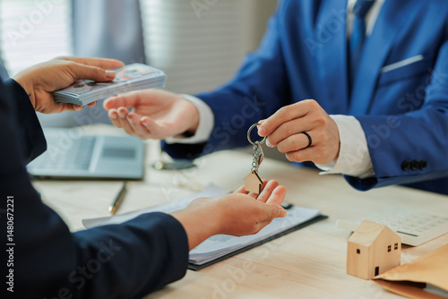 Client pays the agent, who hands over the house keys, marking the official closing and completion of the real estate transaction.