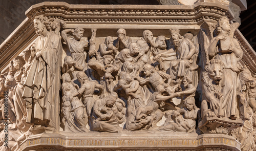 PISTOIA, ITALY - MARCH 16, 2025: The marble relief of Massacre of Inocents on the medieval pulpit in the church Pieve di Sant'Andrea by Giovanni Pisano from year 1301.