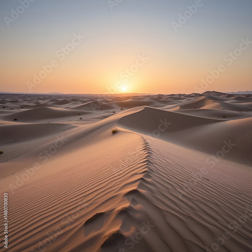 Fototapeta Naklejka Na Ścianę i Meble -  Sunrise over the golden dunes of the desert.A breathtaking view of a vast desert landscape at sunrise.