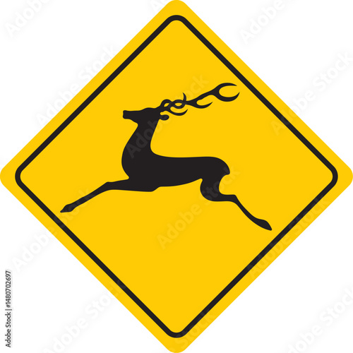 A wild animal on the road. Yellow traffic sign